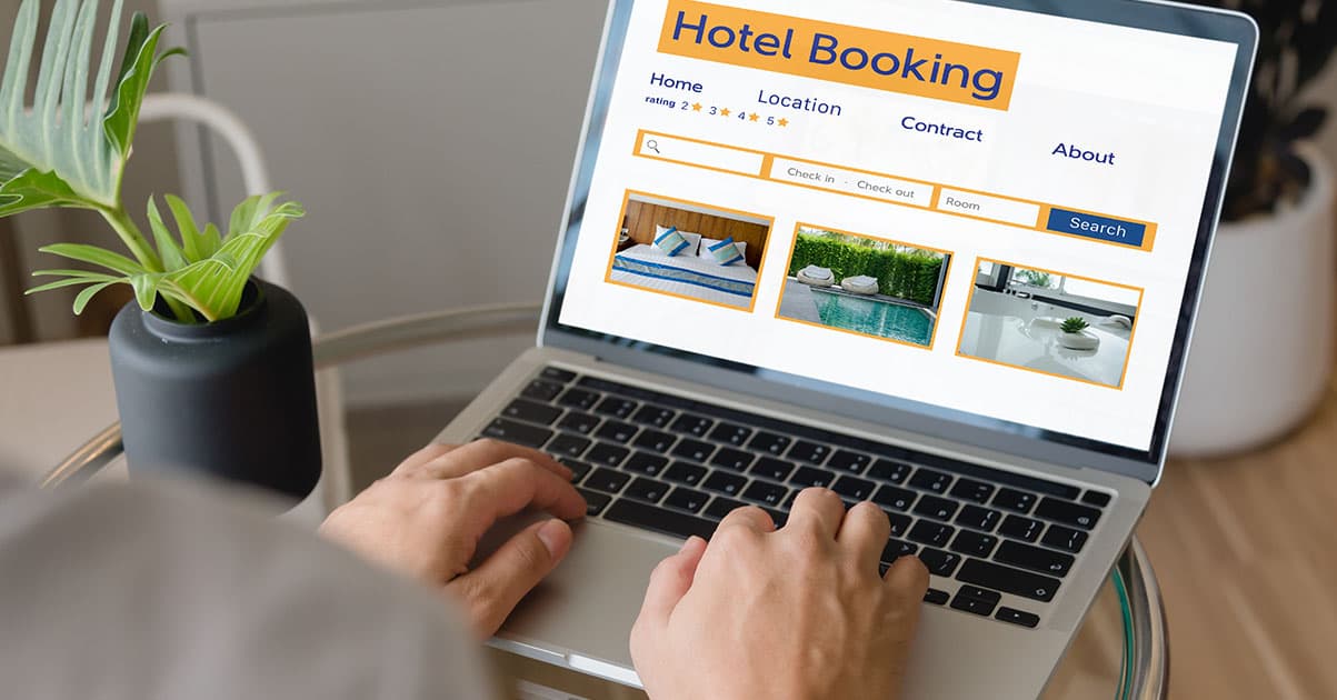 Hotel exterior or lobby with booking confirmation on tablet